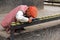 A Nepalese men removing soot at Kumbeshwar Temple in Patan, Nepal