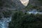 Nepalese mountain village by a suspension bridge over the Marshyangdi river