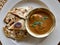 Nepali breakfast meal, Paratha stuffed bread dish with Egg curry served in Nepal