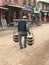 Nepali man carrying traditional curd