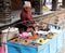 A Nepali street hawker selling snacks