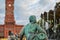 Neptune Fountain as tourists relax in the courtyard  of the Rotes Rathaus or Red Town Hall in Alexanderplatz in Berlin, Germany