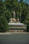 Neptune fountain among leafy trees in Madrid