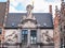 Neptune marble statue in the facade of the old fish market building in the historic center of Ghent