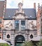 Neptune marble statue in the facade of the old fish market building in the historic center of Ghent