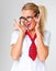 Nerdy yet naughty. Studio shot of a beautiful young woman in a school uniform against a gray background.