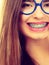 Nerdy woman showing her teeth with braces