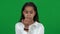 Nervous African American teen girl biting nails on green screen. Portrait of anxious worried teenager waiting for test