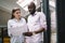 Nervous black man working on startup with colleague