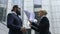 Nervous businesswoman throwing papers in front of male colleague, stressful job