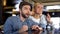 Nervous couple watching competition in bar, supporting their favorites, fun