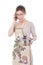 Nervous housewife in apron holding pot and talking on mobile