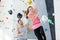 nervous lady on indoor climbing wall