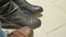 Nervously knocks foot in anticipation of something. men`s shoes and women`s boots close-up shot