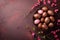 A nest filled with chocolate Easter eggs sits on a textured surface, adorned with pink flowers, festive and elegant