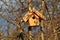 Nesting boxes at an apple tree in the sunlight