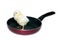 Nestlings little yellow chick on frying pan with non-stick coating