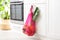 Net bag with vegetables hanging on cabinet door