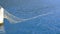 A Net Off is Thrown Into the Sea From a Small Fishing Boat