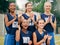 Netball, sports and applause with a woman team in celebration of a victory as a winner on a field outside. Fitness