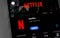 Netflix logo, icon app on screen smartphone iPhone closeup