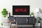 Netflix on TV home background image, global provider of streaming movies and TV series