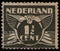 NETHERLANDS - CIRCA 1935: stamp shows stylized animal bird flying dove, value of 1.5 (one and half) dutch cents