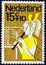 NETHERLANDS - CIRCA 1964: A stamp printed in the Netherlands from the `Child Welfare` issue shows a girl playing the recorder