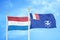 Netherlands and French Southern and Antarctic Lands two flags on flagpoles