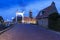 Netherlands - Hindeloopen - a magical evening on a stone path that leads over a drawbridge over a water channel to the harbor.