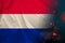 Netherlands national flag on silk  background coronavirus  tourism concept  state border quarantine measures  vaccination