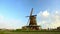 Netherlands timelapse with  old traditional windmill on the river bank