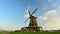 Netherlands timelapse with  old traditional windmill on the river bank