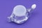 Neti Pot with Soft Comfort Tip isolated on purple. Sinus wash. Nasal irrigation.