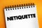 Netiquette is a set of rules that encourages appropriate and courteous online behavior, text concept on notepad