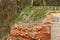 Netting over the red sandstone Jurassic rock at Sidmouth in Devon is part of the new Alma Bridge development and will prevent