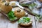 Nettle buns served with butter, cheese and greens. Rustic style