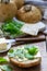 Nettle buns served with butter, cheese and greens. Rustic style