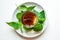 Nettle infusion with nettle leaves in a transparent cup