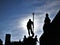 Nettuno statue silhouette covering the sun