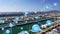 Network of digital icons against aerial view of harbor in background