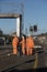 Network rail workers work on a signal gantry