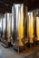 A network of steel vessels, these tanks serve as the lifeblood of the indoor industrial facility, their efficient