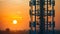 Networking at Dusk: Silhouette of a Tech Tower Against a Fiery Sunset. Concept Silhouette