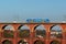 Netzschkau, Germany - April 30, 2023: Vogtland regional train crosses the Goltzsch Viaduct, the largest brick-built railway bridge