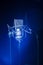 Neumann TLM 102 studio recording microphone with a spotlight on it