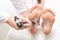 A neurologist doctor checks the plantar reflex in a patient s girl with a neurological hammer. Diagnosis of multiple sclerosis