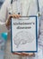 Neurologist doctor holds clipboard with Alzheimer\'s disease and
