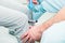 The neurologist testing knee reflex on a female patient using a hammer. Neurological physical examination. Selective focus, close