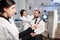 Neurology researcher adjusting brain headset on patient during study